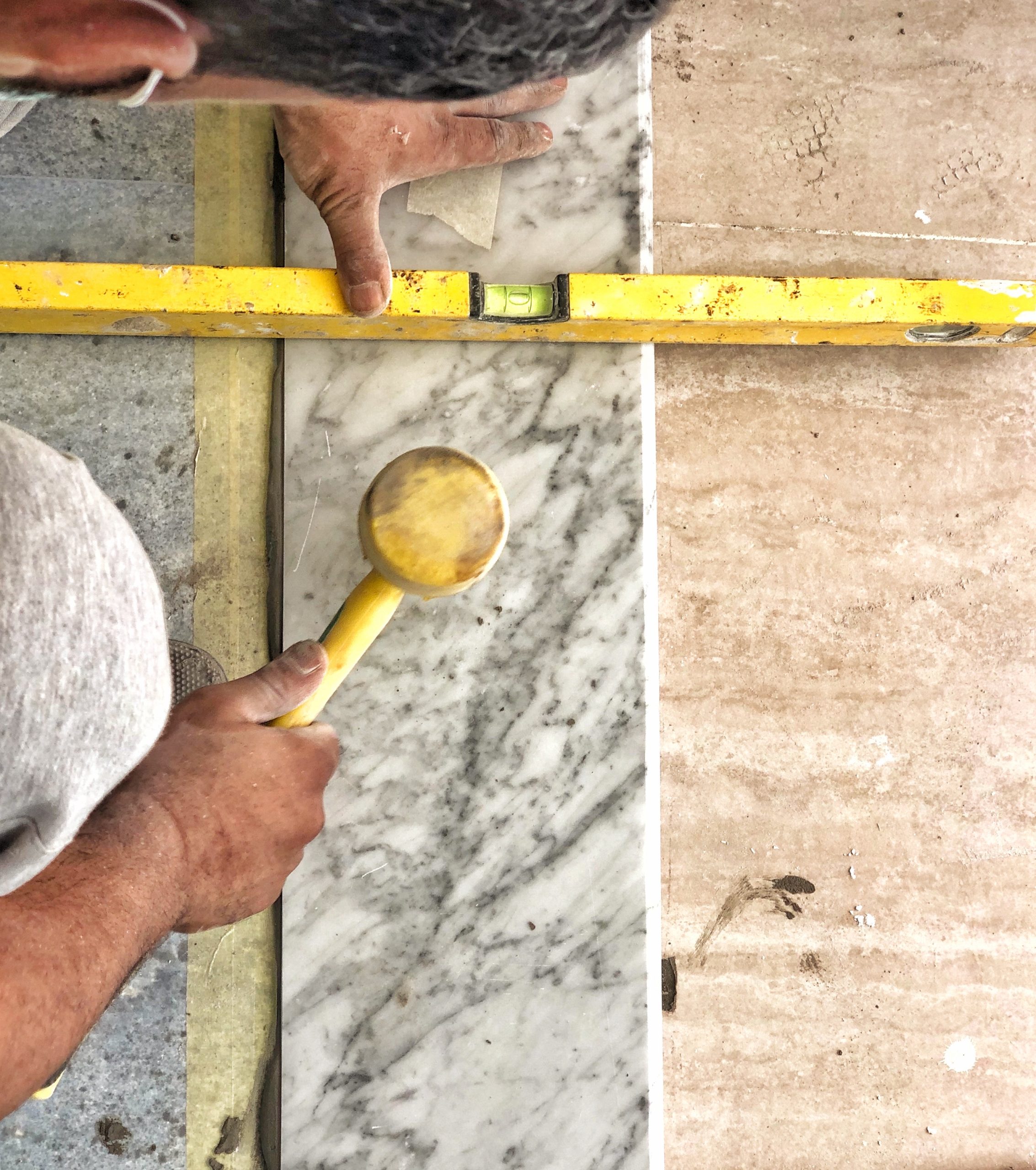 construction-construction-worker-laying-a-marble-2022-11-08-08-45-32-utc (1)